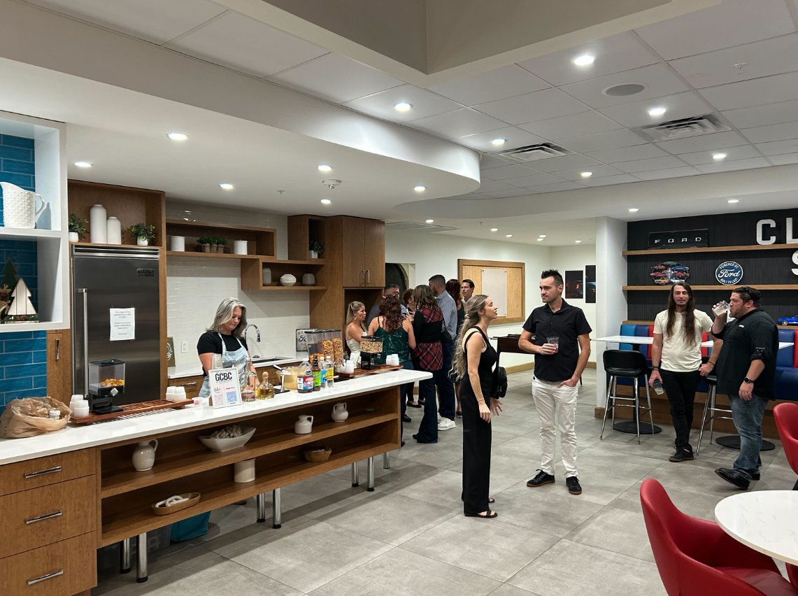 BuyerBridge team gathering in the office kitchen