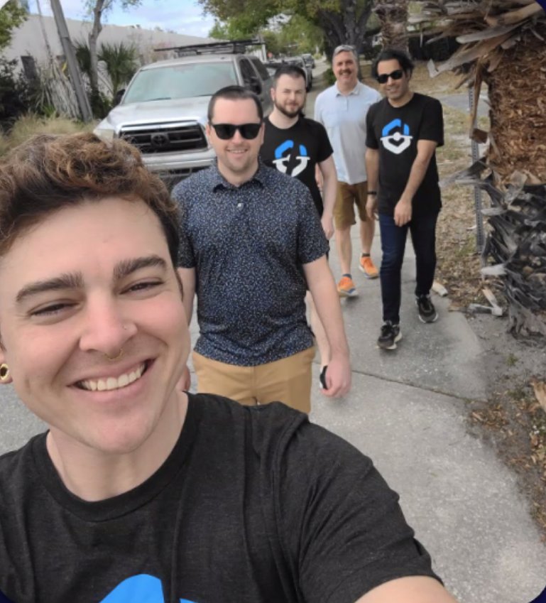 BuyerBridge team members taking a selfie on a walk outside the office